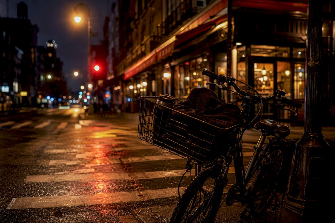 Scooter ready for nighttime cannabis delivery on NYC street